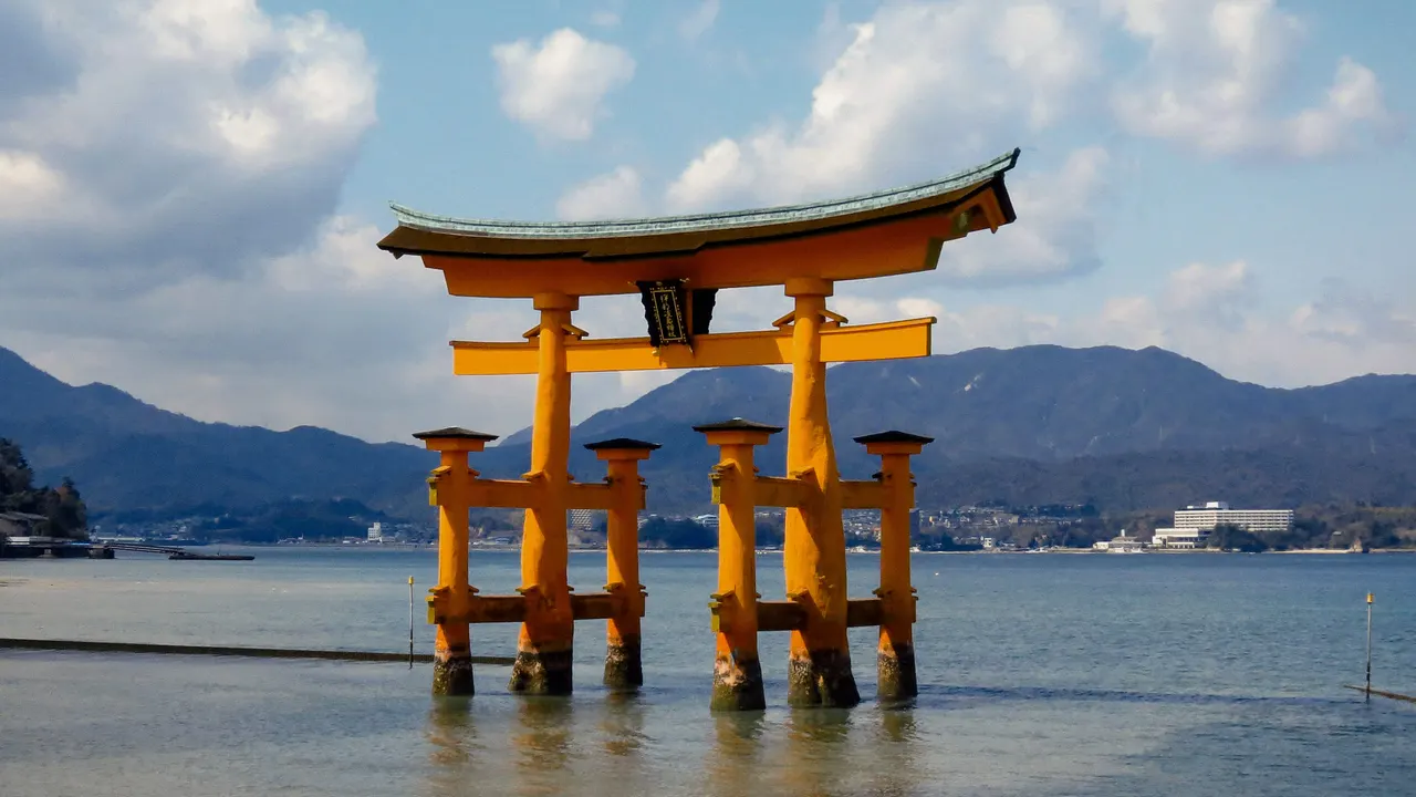 The great torii of Itsukushima Shrine standing in the water off Miyajima, Hiroshima