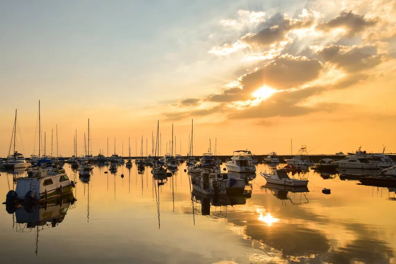 Manila Bay sunset over the yacht harbor in Manila, Philippines